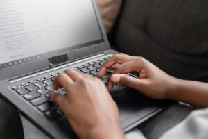 Person Using Black and Gray Laptop Computer